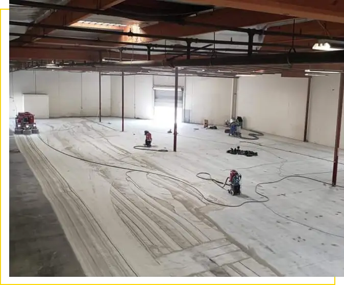 Warehouse floor being prepped for epoxy